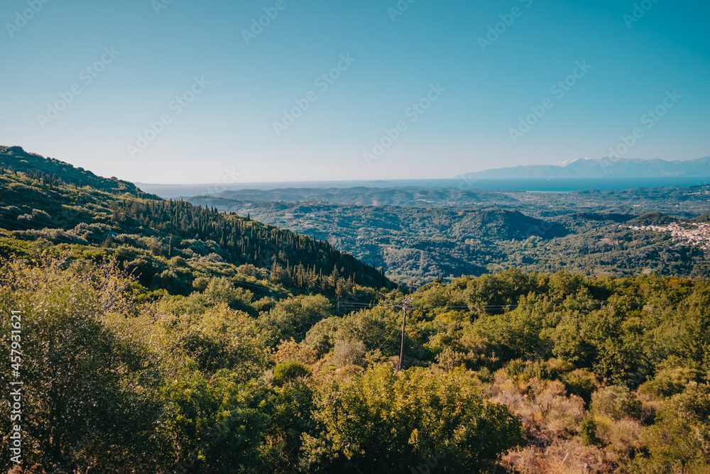 Beautiful summer landscape of south Greece island in Europe. Mediterranean Ionian sea and mountains on horizon.