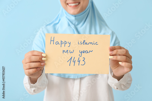 Young Muslim woman with gre...