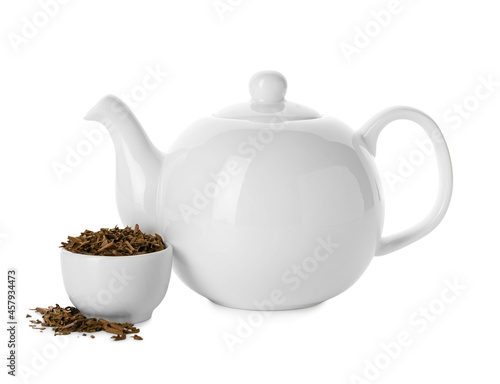 Pot and bowl with dry hojicha green tea on white background