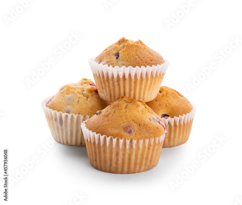 Tasty cranberry muffins on white background