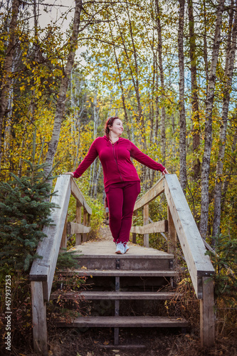 woman walking in autumn park