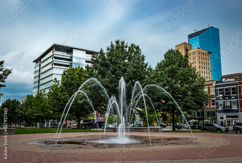 Lexington, Kentucky downtown fountain with financial business district of the city visible in a distance