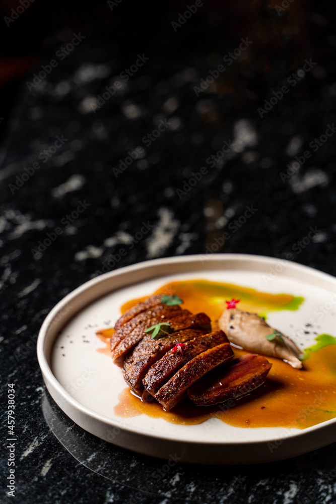 Veal steak cut and rooted with a liver pate, top view, fine dining restaurant Veal steak cut and rooted with a liver pate, top view, fine dining restaurant
