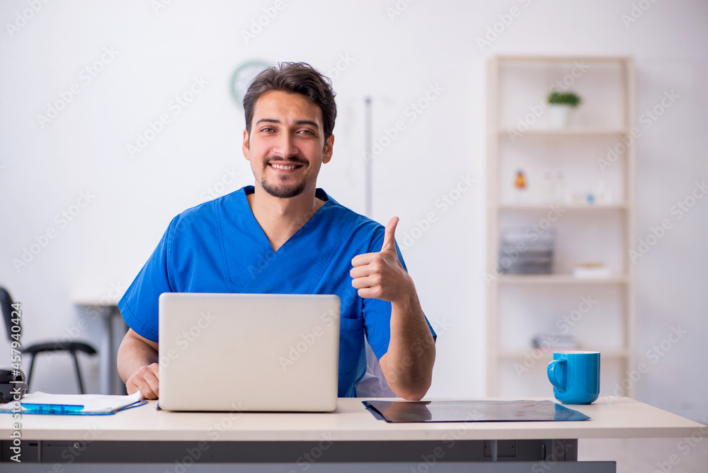 Young male doctor in telemedicine concept Young male doctor in telemedicine concept