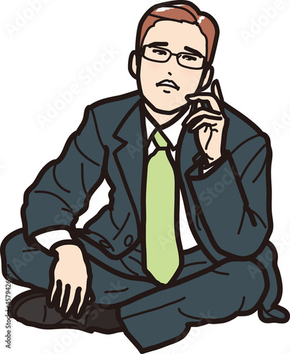 座り込んで思案するビジネスマン