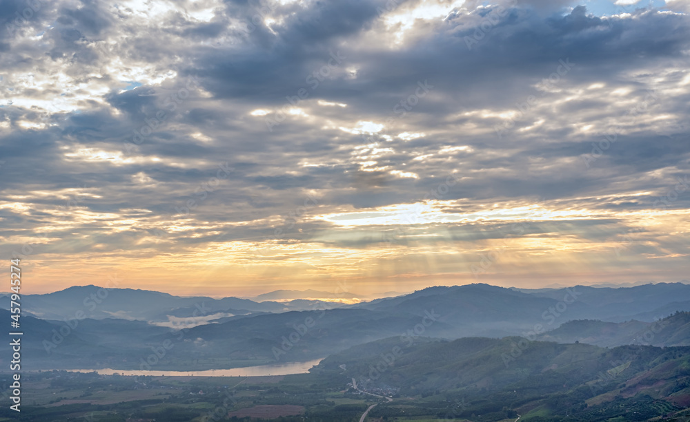 Landscape with clouds,sky and  mountains of northern Thailand. Mountains in Asia in the morning sun through the clouds.