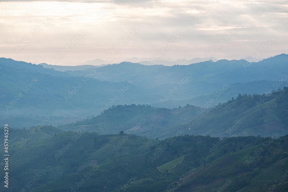 Surreal landscape of morning foggy..Morning clouds at sunrise.Landscape of fog and mountains of northern laos Surreal landscape of morning foggy..Morning clouds at sunrise.Landscape of fog and mountains of northern laos