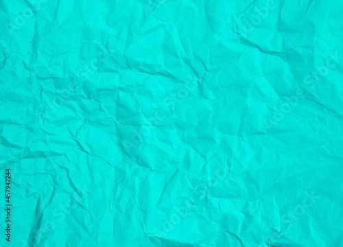 Crumpled turquoise blue paper abstract background texture
