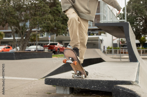 Teenager boy in a skate park, outdoor portrait. adolesence concept, teen culture. 