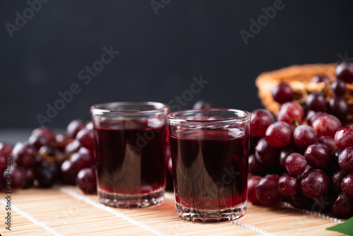 Tela Red grape juice in a glass with fresh grape, Healthy drink, Still Life