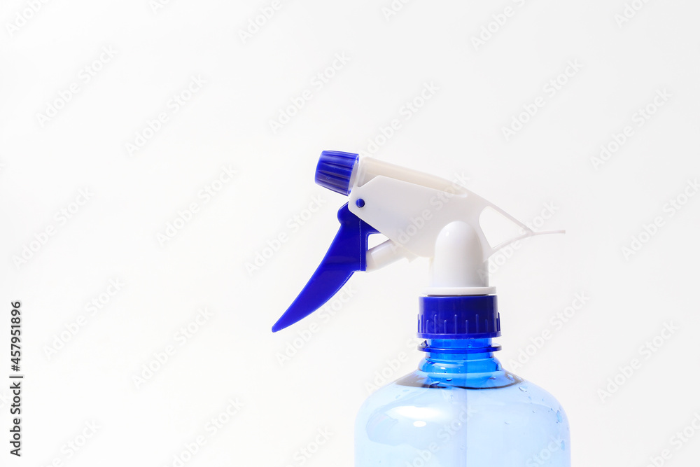 Blue atomizer on white background with space for text Blue atomizer on white background with space for text