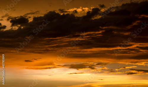 Dramatic cloudy golden sky after the sunset © Xookits
