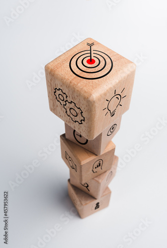 Business strategy with growth success process for for Leadership and teamwork concept. The action plan, business target icon on wooden cube blocks stack on white background, vertical style.