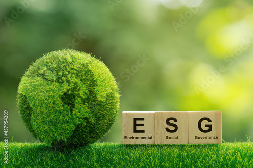 ESG concept of environmental, social and governance.words ESG on a woodblock It is an idea for sustainable organizational development. account the environment, society and corporate governance photo