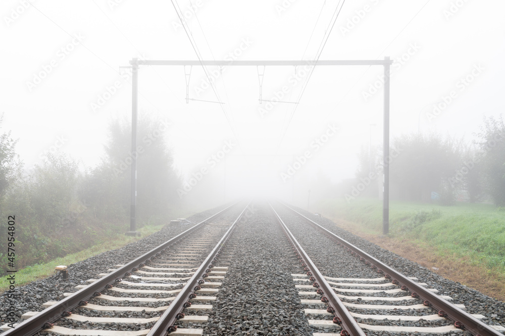 Fototapeta premium Sunrise to the track whit an train