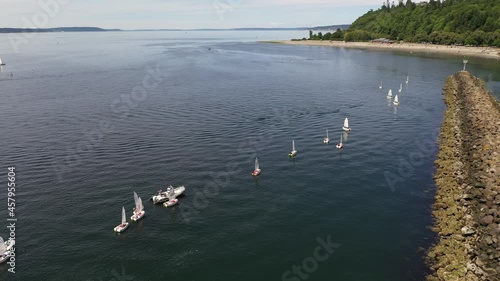 Cinematic 4K aerial drone footage of sailboats by Sunset Hill, Golden Gardens, Meadow Point, Loyal Heights, Shilshole Bay Marina near Ballard, Seattle, by Puget Sound with sailboats and yachts photo