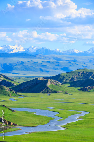 Bayinbuluke grassland natural scenery in Xinjiang,China.Beautiful grassland and mountain landscape. photo