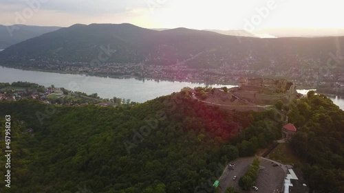 Cinematic 4K aerial drone bird's-eye clip of the Visegrád High Castle, a 13th-century fortress, royal palace, atop a hill a museum with stunning panoramic, scenic river views in Hungary photo