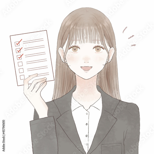 チェックリストを持つスーツを着た女性