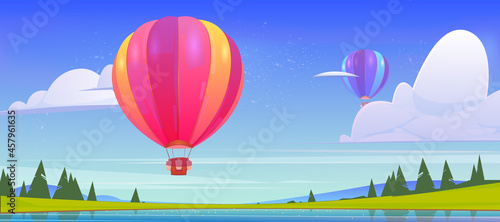 Hot air balloons flying above pond, green field and mountain peaks in blue sky. Scenery nature summer background, aerostat with baskets and sand sacks flight, aero festival Cartoon vector illustration