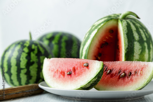 Waterelon, honey watermelon on wooden table background. photo