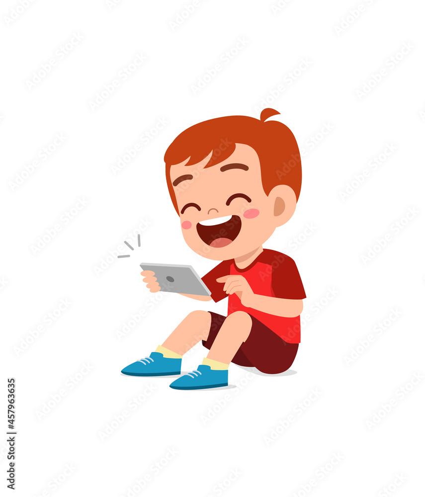 little boy using mobile phone and laugh