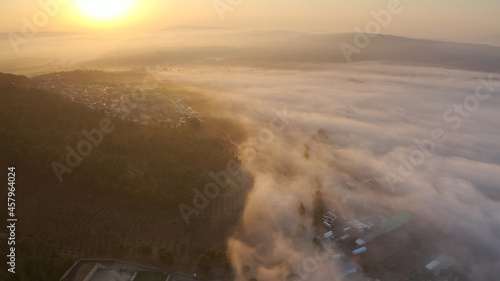 Mount Tavor in the fog at sunrise, Aerial view Drone view from North Israel at sunrise with Clouds covering the mountain,2021 