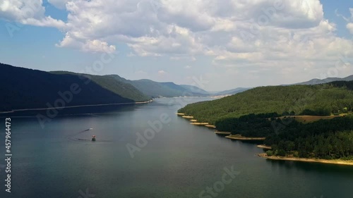 Wallpaper Mural Slow aerial pan shot over Dospat resrervoir,Rhodopes Bulgaria with motor boat heading along the dam Torontodigital.ca