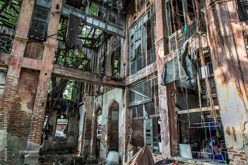 The abandoned building with visible bricks texture was left to deteriorate over time and visible parts of structural elements and ruins. Traditional Architecture style, Selective focus. The abandoned building with visible bricks texture was left to deteriorate over time and visible parts of structural elements and ruins. Traditional Architecture style, Selective focus.