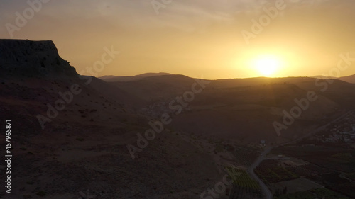 Small town surrounded By desert Cliffs at sunset Desert Cliff at sunset done view