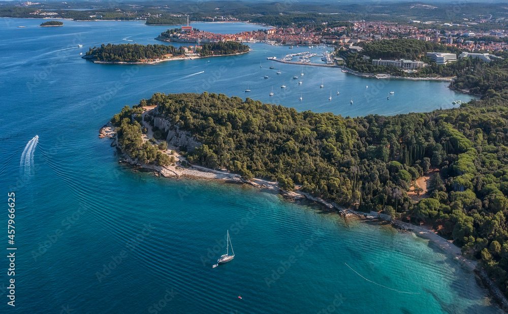 Panoramic view of Rovinj coastline with Rovinj old town in the distance, beautiful park Punta Corrente, Lone Bay and St. Catherine island