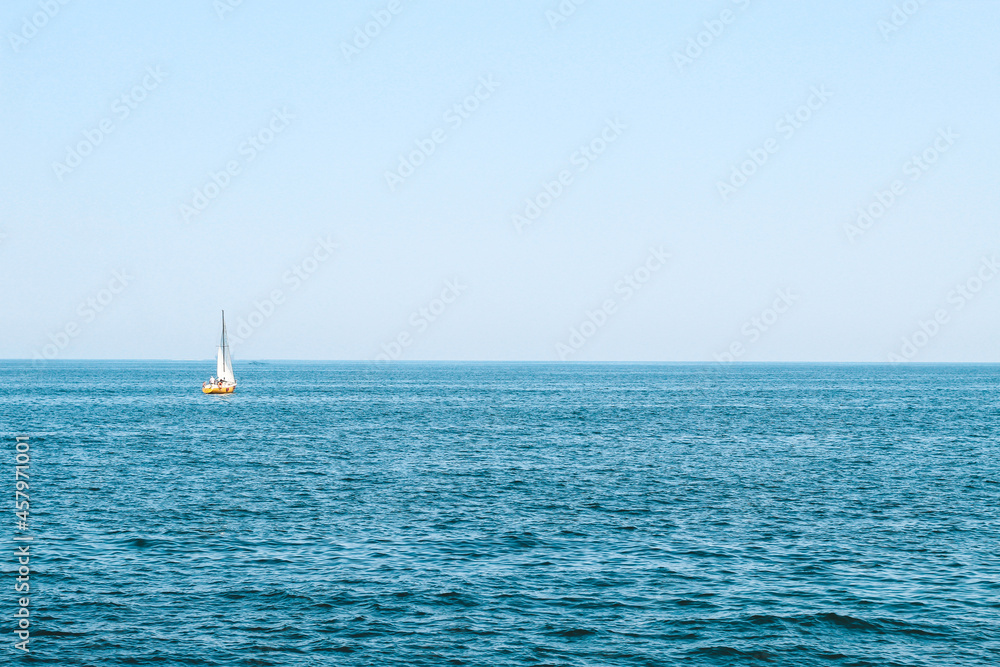 Fototapeta premium tourist boat sailing here on the blue sea.