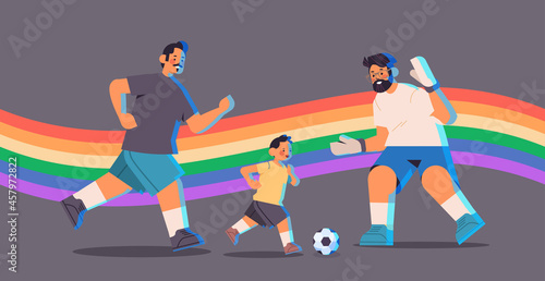 male parents playing football with little son gay family transgender love LGBT community concept