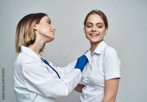 female doctor stethoscope healing procedures light background