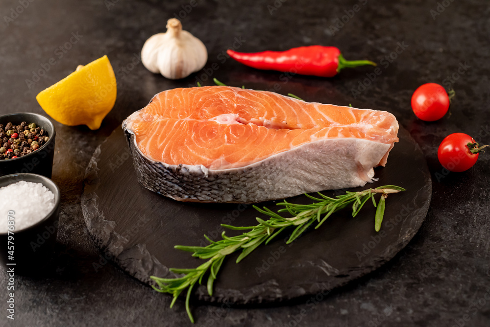 raw salmon steak on stone background raw salmon steak on stone background