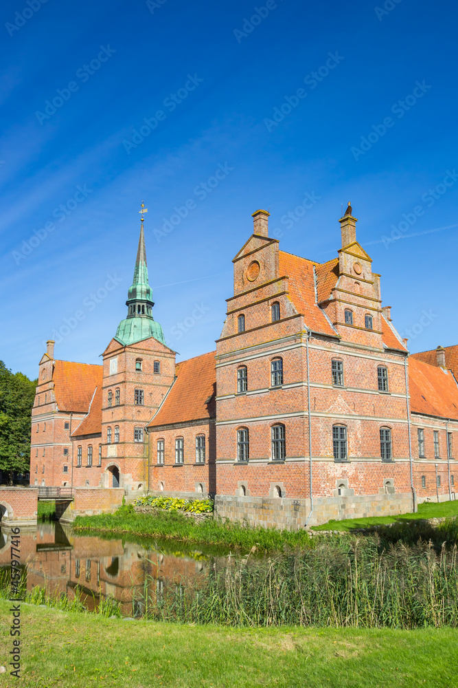 Historic castle surrounded by water in Rosenholm, Denmark