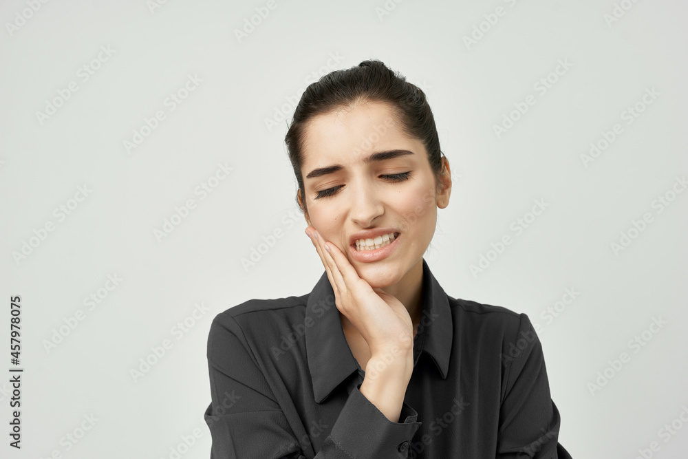 woman in black shirt holding his head depressed health problems woman in black shirt holding his head depressed health problems