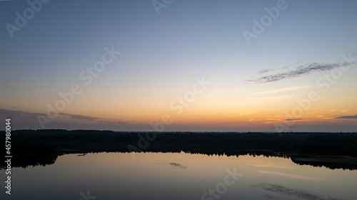 Beautiful  colorful sky over a lake at sunset. Peaceful scene  no one in sight. . High quality photo
