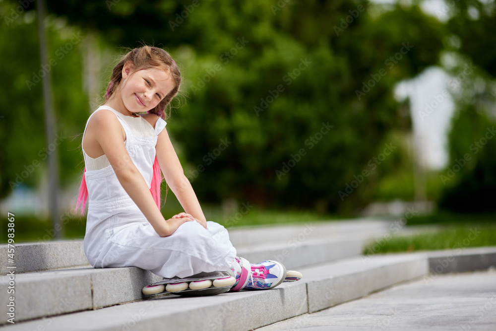 cute little girl on roller skates at park. cute little girl on roller skates at park.