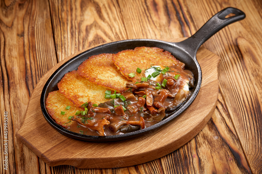 potato pancake with meaat on the pan