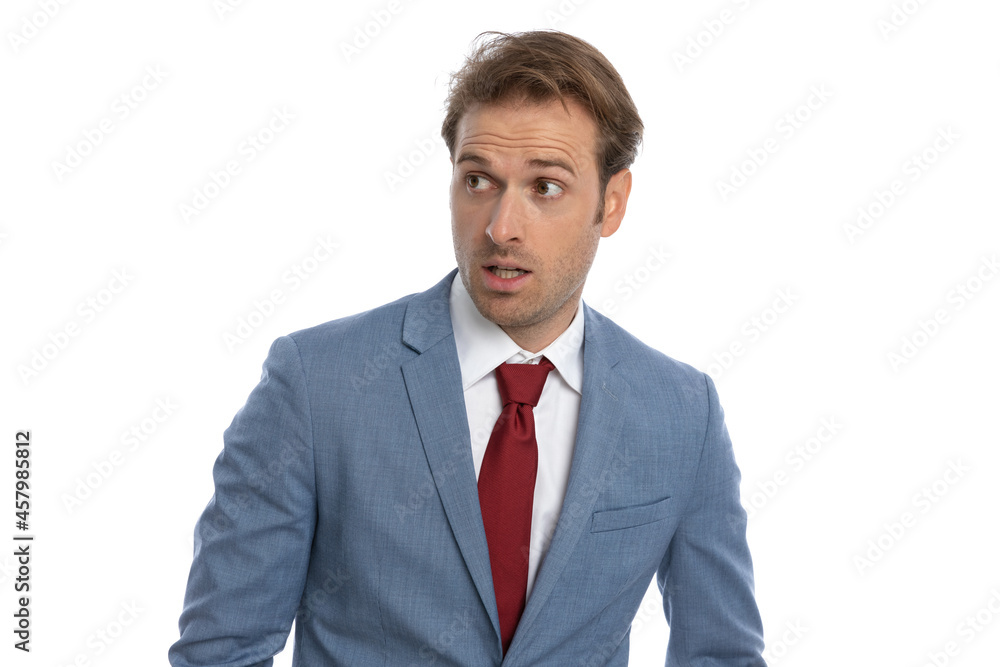scared elegant guy in blue suit looking to side and feeling fear scared elegant guy in blue suit looking to side and feeling fear
