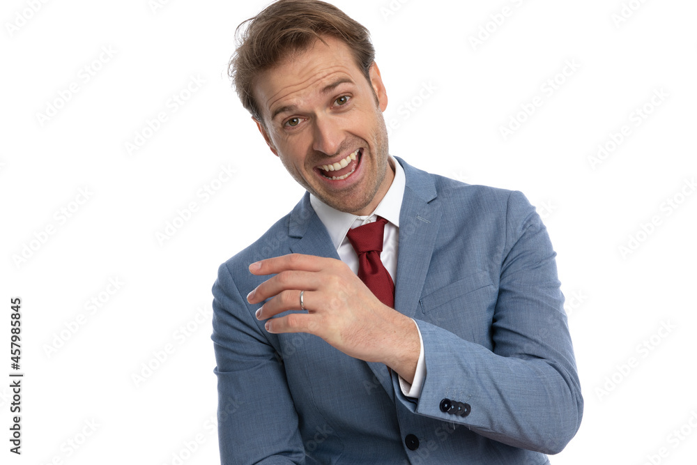 portrait of happy young businessman in blue suit laughing portrait of happy young businessman in blue suit laughing