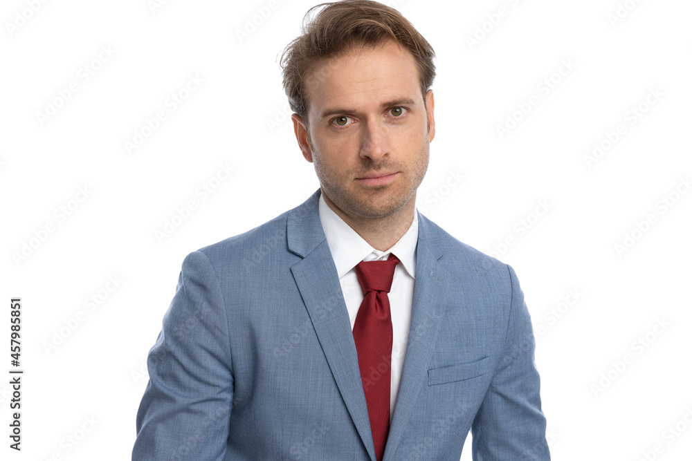 sexy young businessman in blue suit being confident and posing sexy young businessman in blue suit being confident and posing