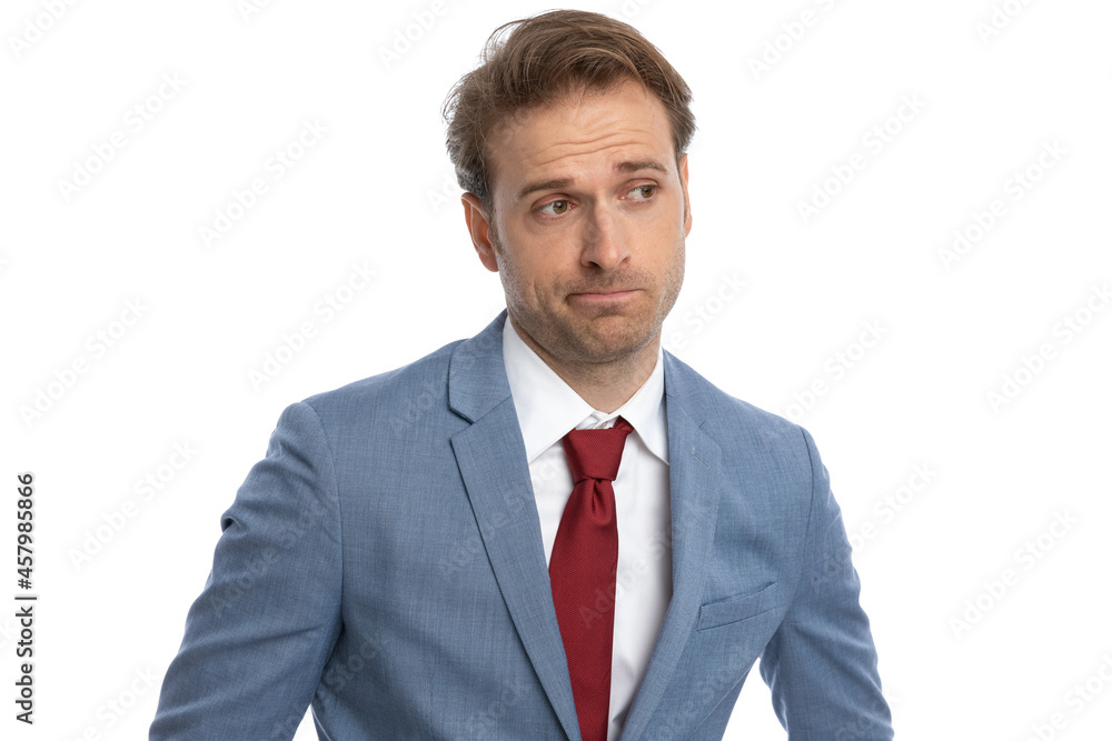 thoughtful elegant businessman making a sad face and thinking thoughtful elegant businessman making a sad face and thinking