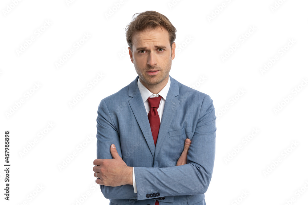 sexy elegant businessman in blue suit folding arms and being confident sexy elegant businessman in blue suit folding arms and being confident
