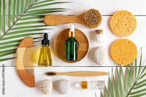 Set of bath personal care accessories with eco cosmetics and bamboo toothbrushes on white background  pattern