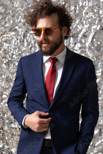 cool businessman holding one hand in pocket photo