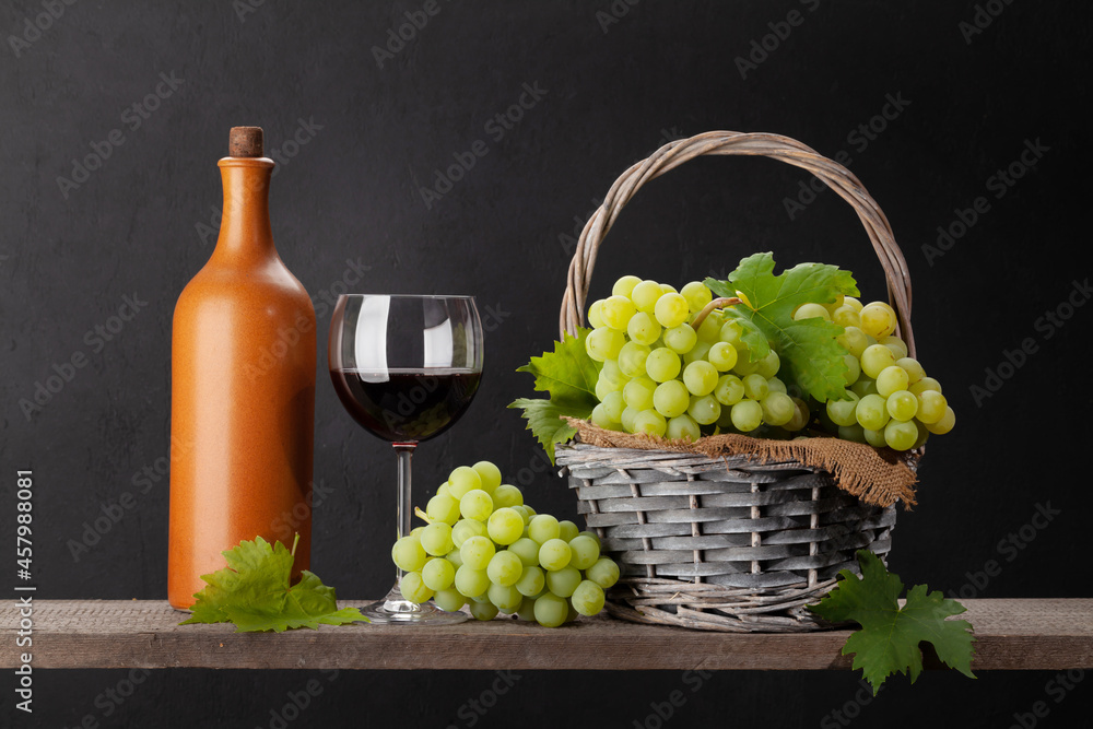 White grape, bottle and red wine glass