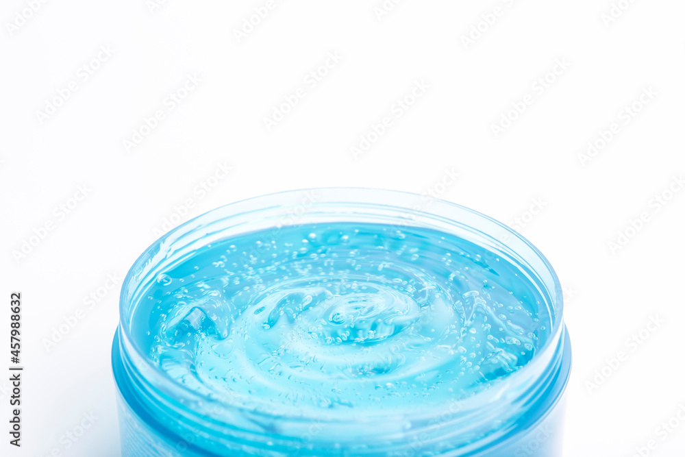 Cosmetic gel in a jar on a white background. Blue transparent gel with texture and bubbles isolate Cosmetic gel in a jar on a white background. Blue transparent gel with texture and bubbles isolate