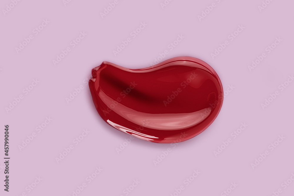 Red makeup smear texture of lip gloss balm. Red makeup smear texture of lip gloss balm.
